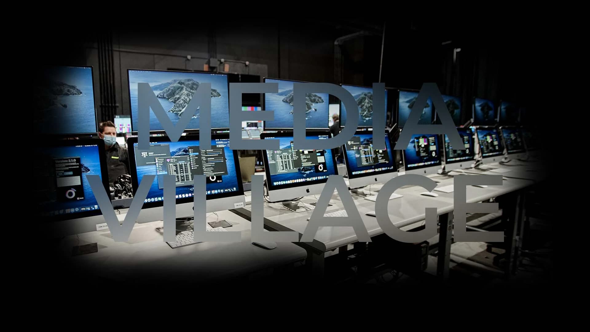 The Media Village at Worre Studios — rows of workstations managing a global remote audience.