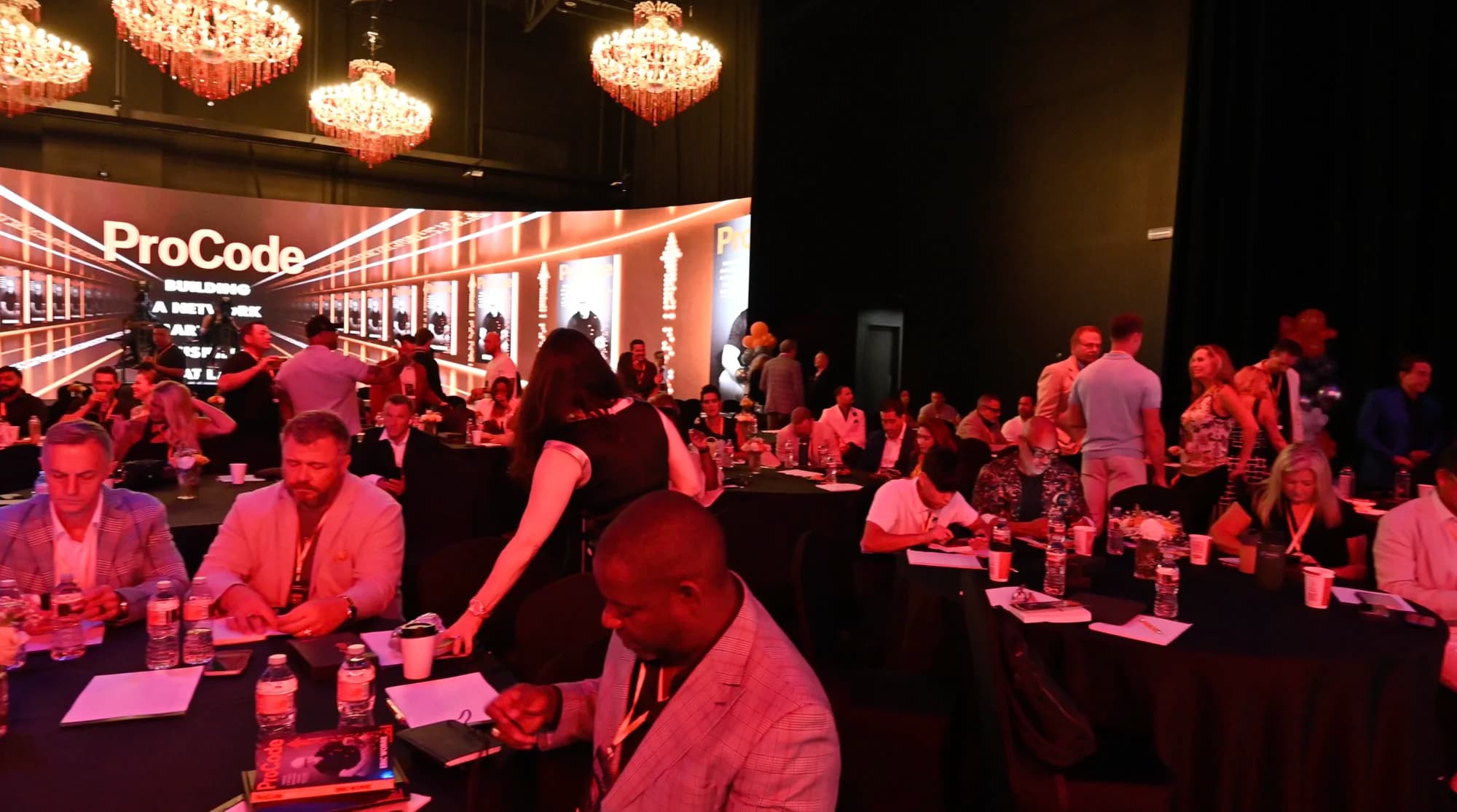 A live audience surrounding the 360° LED stage floor.