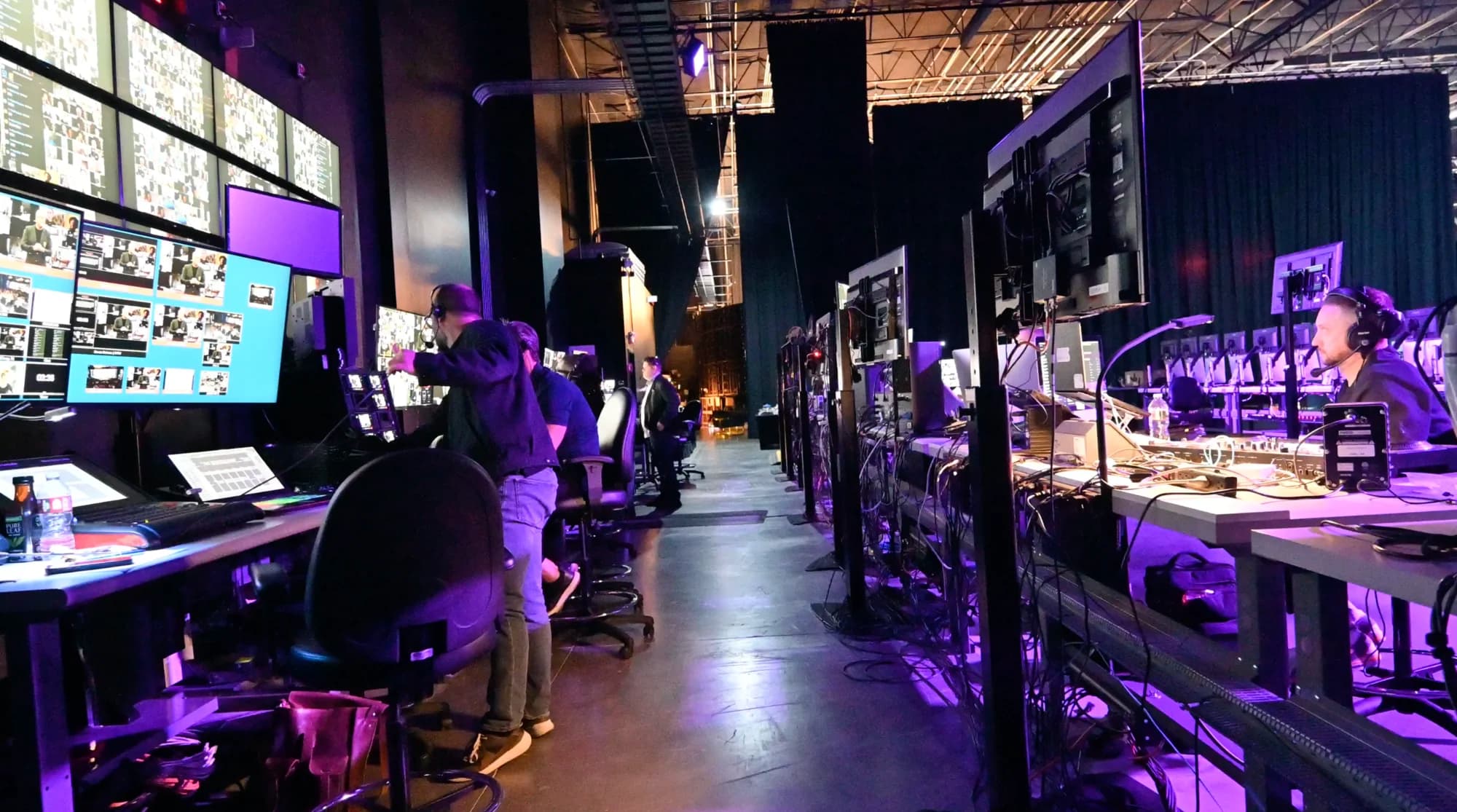Remote attendees live on the LED wall during a hybrid event.