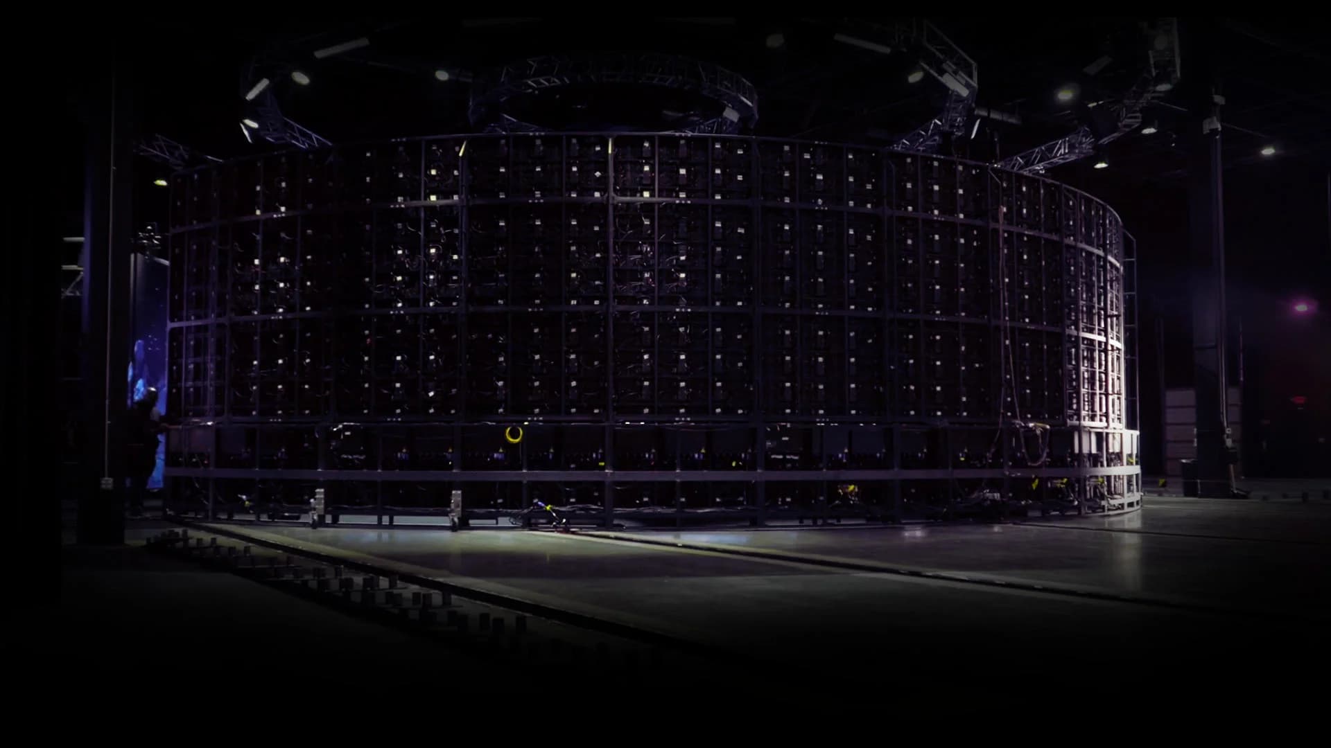 Inside the patented 360° interactive studio — curved LED screens wrap the room in every direction.
